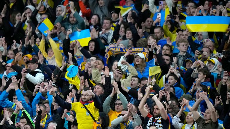 Ukrainian fans cheer their team in spite of the result