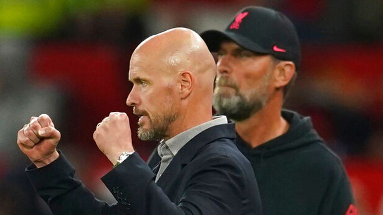 Manchester United's head coach Erik ten Hag celebrates at the end the English Premier League soccer match between Manchester United and Liverpool at Old Trafford stadium, in Manchester, England, Monday, Aug 22, 2022. In background is Liverpool's manager Jurgen Klopp. (AP Photo/Dave Thompson)