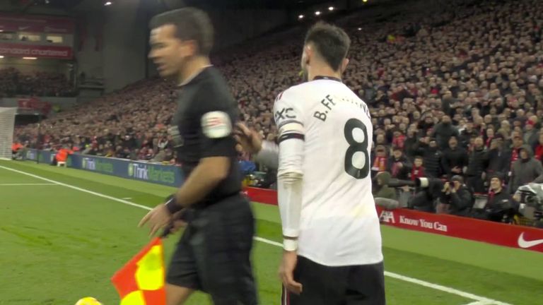 With Manchester United 5-0 down, Fernandes appears to push the linesman closest to the Kop Stand out of the way as he stepped past him