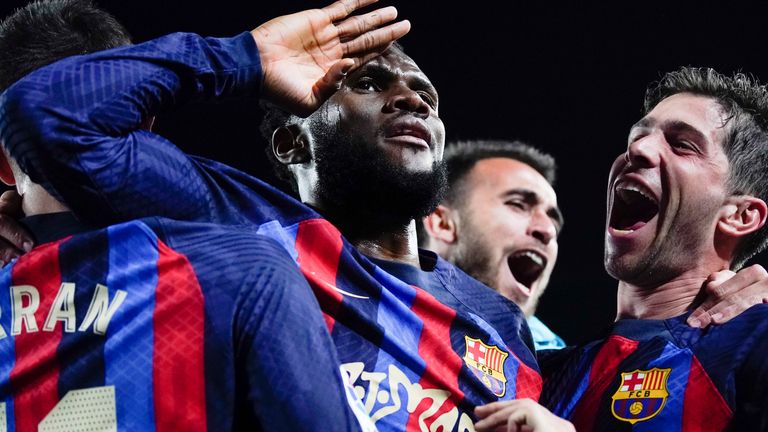 Barcelona&#39;s Franck Kessie, centre, celebrates with teammates after scoring his team&#39;s second goal during the Spanish La Liga soccer match between Barcelona and Real Madrid at Camp Nou stadium in Barcelona, Spain, Sunday, March 19, 2023. (AP Photo/Joan Mateu)