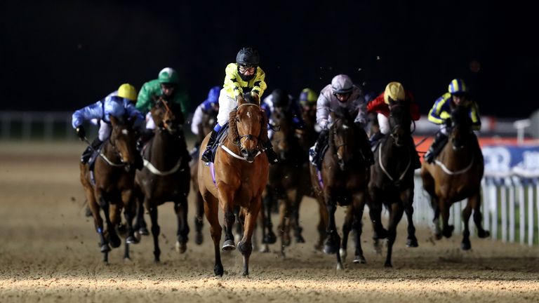 Gavi Di Gavi ridden by Georgia King (yellow) on their way to winning the Bombardier March To Your Own Drum Handicap at Wolverhampton