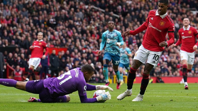 Southampton goalkeeper Gavin Bazunu saves from Manchester United's Marcus Rashford during the Premier League match at Old Trafford, Manchester. Picture date: Sunday March 12, 2023