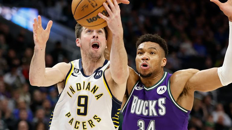 TJ McConnell and Giannis Antetokounmpo contest for the ball in the Indiana Pacers&#39; win over the Milwaukee Bucks in the NBA