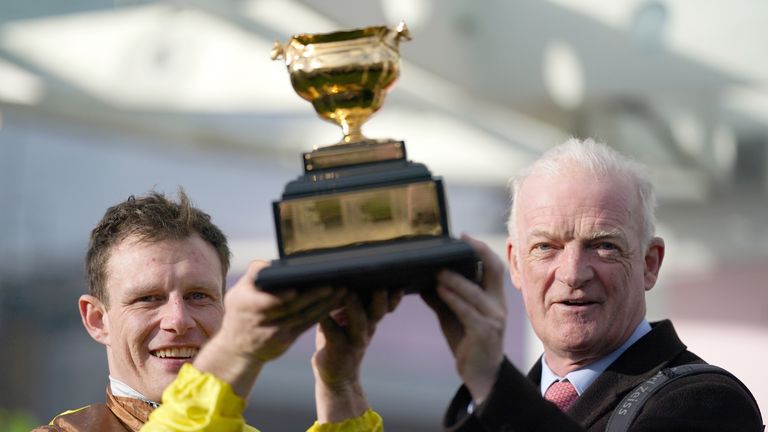 Paul Townend and Willie Mullins lift the Cheltenham Gold Cup trophy for a third time