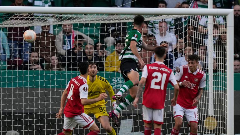 Sporting's Goncalo Inacio, top, heads in a first-half equaliser against Arsenal
