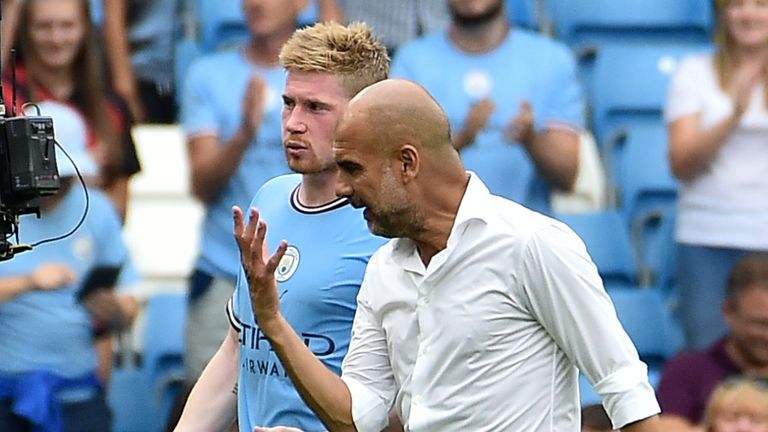 Manchester City's head coach Pep Guardiola, right, talks to Manchester City's Kevin De Bruyne, center, at the end of the English Premier League soccer match between Manchester City and Crystal Palace at Etihad stadium in Manchester, England, Saturday, Aug. 27, 2022. Manchester City won 4-2. (AP Photo/Rui Vieira)