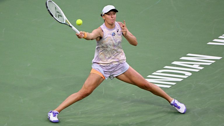 INDIAN WELLS, CA - MARCH 13: Iga Swiatek of Poland chases after the ball during a tennis match at the BNP Paribas Open played on March 13, 2023 at the Indian Wells Tennis Garden in Indian Wells, CA. (Photo by John Cordes/Icon Sportswire) (Icon Sportswire via AP Images)