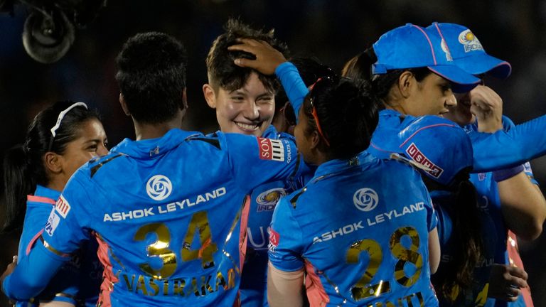 Mumbai Indians Issy Wong, third left celebrate with teammates the dismissal of Delhi Capitals Shafali Verma during during the Women&#39;s Premier League Twenty20 cricket final match between Delhi Captials and Mumbai Indians in Mumbai, India, Sunday, March 26, 2023. (AP Photo/Rajanish Kakade)