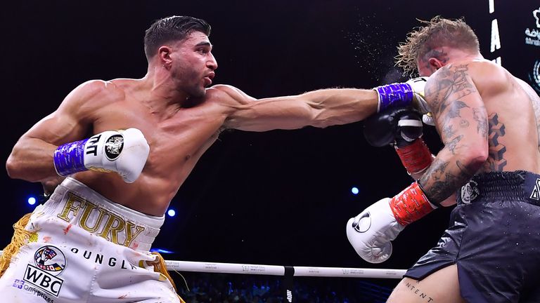 Jake Paul, right, and Tommy Fury, in action during their boxing match, in Riyadh, Saudi Arabia, early Monday, Feb. 27, 2023. (AP Photo)