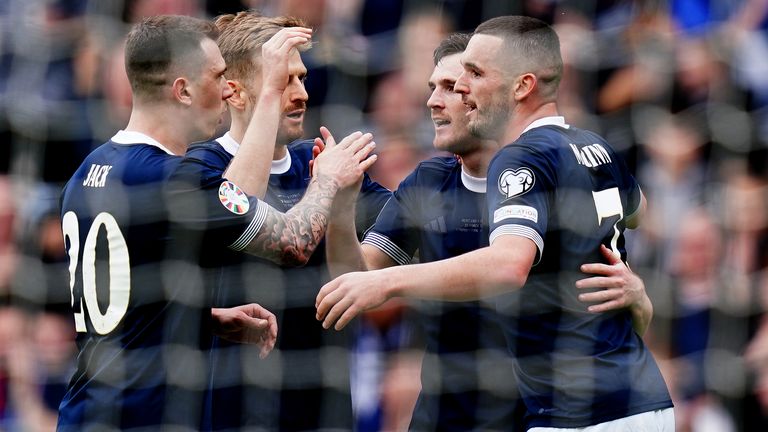Scotland's John McGinn (right) celebrates scoring their side's first goal of the game