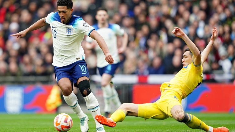 Jude Bellingham is tackled by Taras Stepanenko