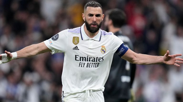 Real Madrid's Karim Benzema celebrates after scoring his sides first goal during the Champions League, round of 16, second leg soccer match between Real Madrid and Liverpool at the Santiago Bernabeu stadium in Madrid, Spain, Wednesday, March 15, 2023. (AP Photo/Bernat Armangue)