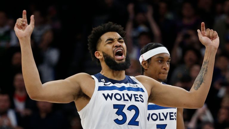 Minnesota Timberwolves center Karl-Anthony Towns celebrates his free throws to give his team the lead over the Atlanta Hawks with seconds left in the fourth quarter of an NBA basketball game Wednesday, March 22, 2023, in Minneapolis. The Timberwolves won 125-124. (AP Photo/Bruce Kluckhohn)