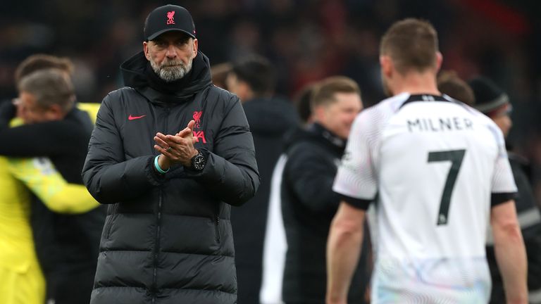 Liverpool manager Jurgen Klopp (left) applauds the fans as player James Milner walks passed dejected after the final whistle in the Premier League match at the Vitality Stadium, Bournemouth. Picture date: Saturday March 11, 2023.