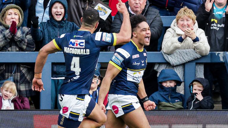 Derrell Olpherts celebrates his late try as Leeds fought back against the Dragons