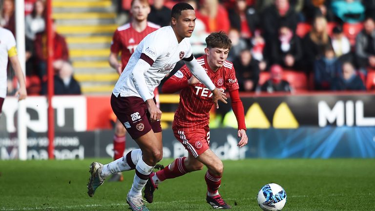 ABERDEEN, SCOTLAND - MARCH 18: Toby Sibbick and Leighton Clarkson in action during a cinch Premiership match between Aberdeen and Heart of Midlothian at Pittodrie, on March 18, 2023, in Aberdeen, Scotland.  (Photo by Paul Byars / SNS Group)