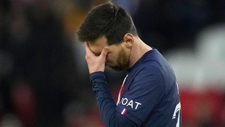 PSG's Lionel Messi touches his forehead in the final minutes of the French League One soccer match between Paris Saint-Germain and Rennes at the Parc des Princes in Paris, Sunday, March 19, 2023. (AP Photo/Christophe Ena)