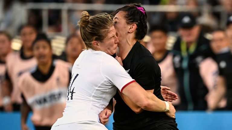 England's Lydia Thompson, left, collides with New Zealand's Portia Woodman during the final of the women's rugby World Cup at Eden Park in Auckland, New Zealand, Saturday, Nov.12, 2022. Thompson is given a red card for the clash. (Andrew Cornaga/Photosport via AP)