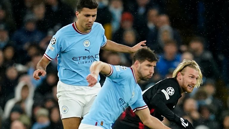 Manchester City&#39;s Rodrigo, Manchester City&#39;s Ruben Dias and Leipzig&#39;s Emil Forsberg, from left, challenge for the ball 