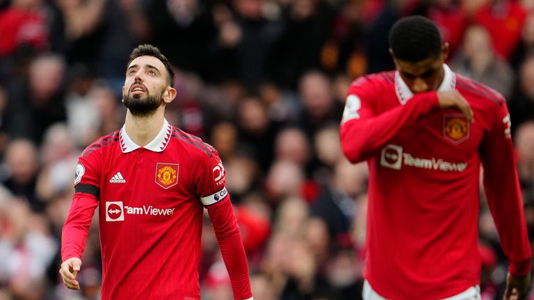 Manchester United's Bruno Fernandes, left, and Manchester United's Marcus Rashford react during the English Premier League soccer match between Manchester United and Southampton at Old Trafford stadium in Manchester, England, Sunday, March 12, 2023. (AP Photo/Jon Super)
