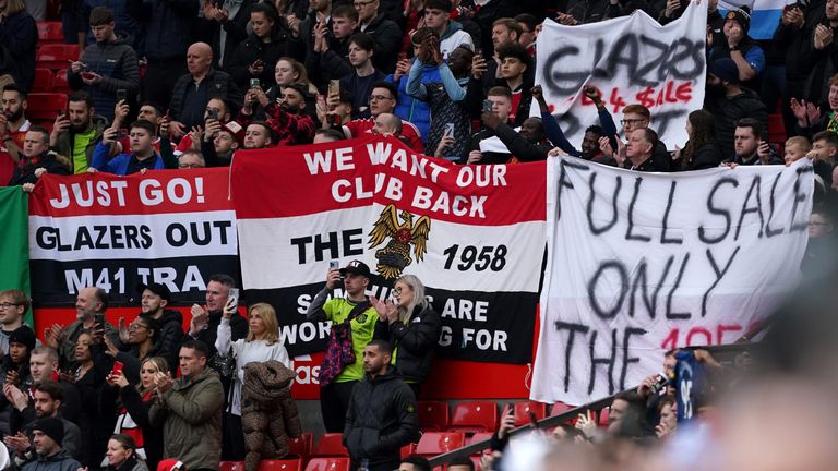 Manchester United fans display banners protesting the club&#39;s ownership