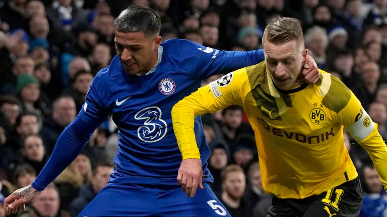 Dortmund&#39;s Marco Reus challenges Chelsea&#39;s Enzo Fernandez 