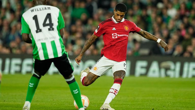 Manchester United's Marcus Rashford shoots to score his side's first goal during the Europa League round of 16 second leg soccer match between Real Betis and Manchester United at the Benito Villamarin stadium in Seville, Spain, Thursday, March 16, 2023. (AP Photo/Jose Breton)