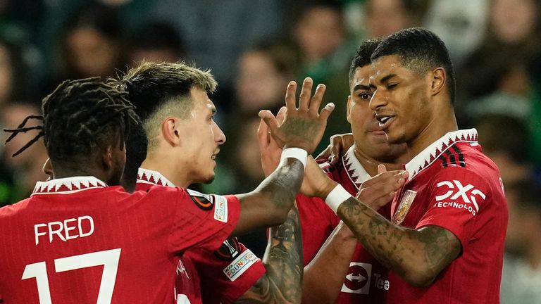 Manchester United&#39;s Marcus Rashford, right, celebrates after scoring his side&#39;s first goal during the Europa League round of 16 second leg soccer match between Real Betis and Manchester United at the Benito Villamarin stadium in Seville, Spain, Thursday, March 16, 2023. (AP Photo/Jose Breton)