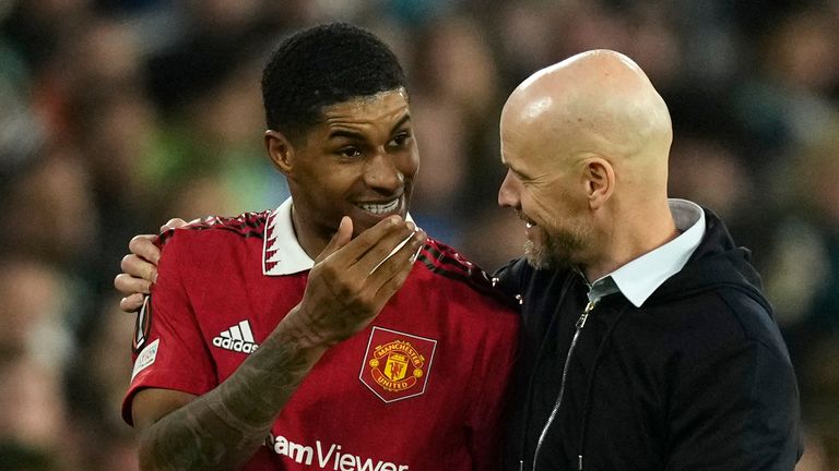 Manchester United's Marcus Rashford speaks to Manchester United's head coach Erik ten Hag after being substituted during the Europa League round of 16 second leg soccer match between Real Betis and Manchester United at the Benito Villamarin stadium in Seville, Spain, Thursday, March 16, 2023. (AP Photo/Jose Breton)