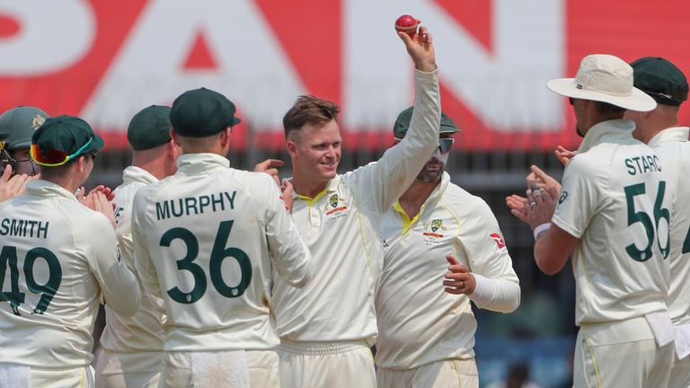 Australia's Matthew Kuhnemann, fourth right without cap, holds up the ball to celebrate his five-wicket haul during the first day of third cricket test match between India and Australia in Indore, India, Wednesday, March 1, 2023. (AP Photo/Surjeet Yadav) 