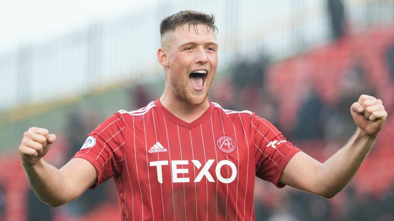 ABERDEEN, SCOTLAND - MARCH 18: Mattie Pollock celebrates at full time during a Premiership cinch match between Aberdeen and Heart of Midlothian at Pittodrie on March 18, 2023 in Aberdeen, Scotland.  (Photo by Paul Byars/SNS Group)