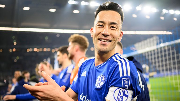 Maya Yoshida joins the applause with the supporters after Schalke's draw with Borussia Dortmund in the derby
