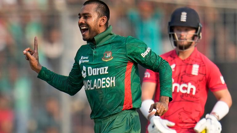 Bangladesh's Mehidy Hasan Miraz celebrates the dismissal of England's Chris Woakes during the second T20 cricket match between Bangladesh and England in Dhaka, Bangladesh, Sunday, March 12, 2023. On the right is England's Ben Duckett. (AP Photo/Aijaz Rahi)