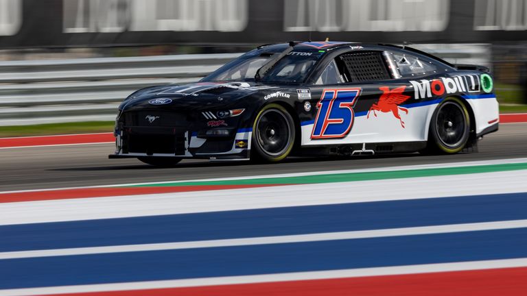 Jenson Button steers his car through Turn 17 during qualifying qualifying for the NASCAR Cup Series auto race at Circuit of the Americas, Saturday, March 25, 2023, in Austin, Texas. (AP Photo/Stephen Spillman)