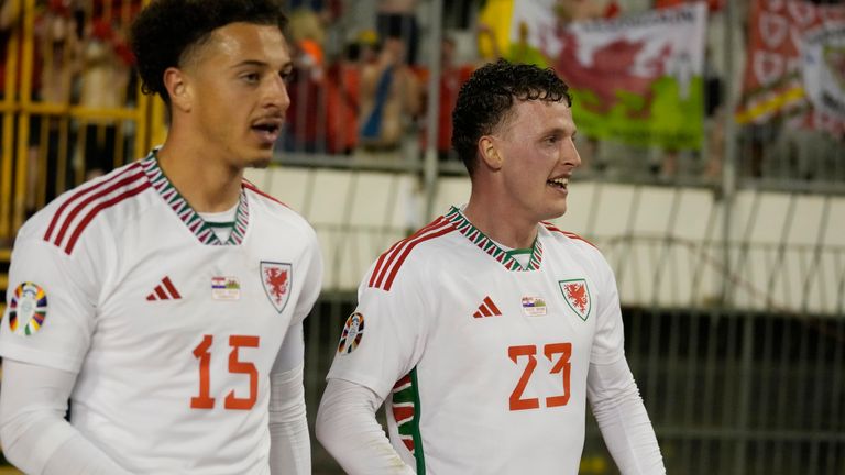 Wales' Nathan Broadhead, right, smiles after scoring his side's opening goal during the Euro 2024 group D qualifying soccer match between Croatia and Wales at the Poljud stadium in Split, Croatia, Saturday, March 25, 2023. (AP Photo/Darko Bandic)