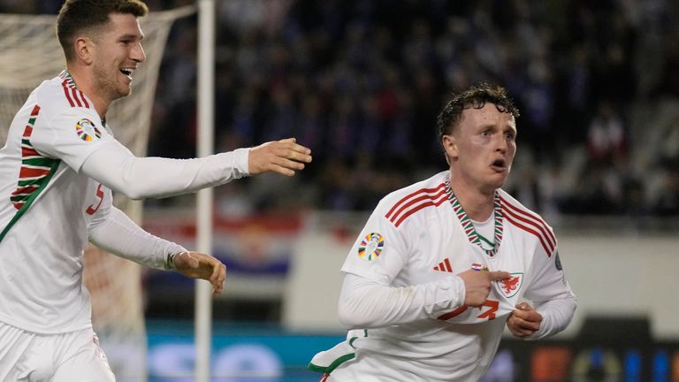 Wales' Nathan Broadhead, right, celebrates after scoring his side's equaliser during the Euro 2024 group D qualifying soccer match between Croatia and Wales at the Poljud stadium in Split, Croatia, Saturday, March 25, 2023. (AP Photo/Darko Bandic)