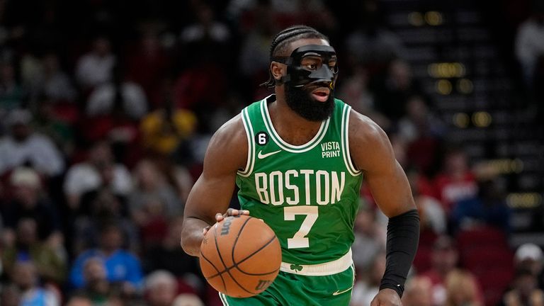 Boston Celtics&#39; Jaylen Brown (7) brings the ball up the court against the Houston Rockets during the first half of an NBA basketball game Monday, March 13, 2023, in Houston.