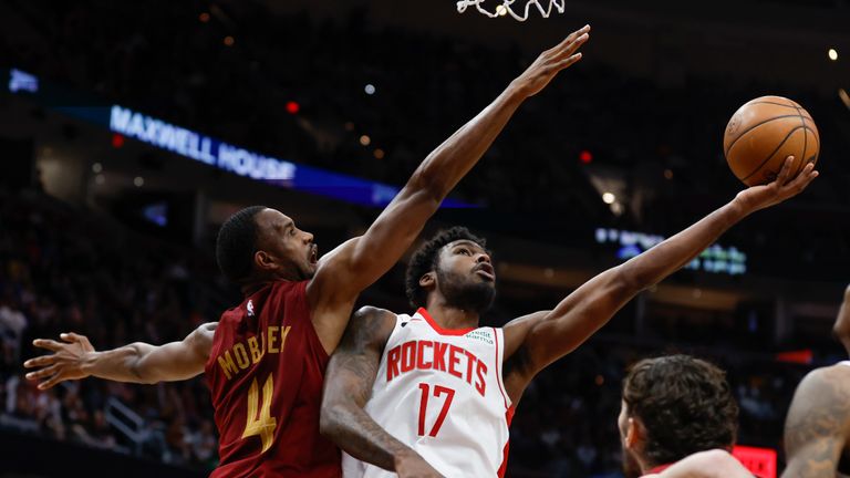 Houston Rockets forward Tari Eason (17) shoots against Cleveland Cavaliers forward Evan Mobley (4) during the second half of an NBA basketball game, Sunday, March 26, 2023, in Cleveland. (AP Photo/Ron Schwane)