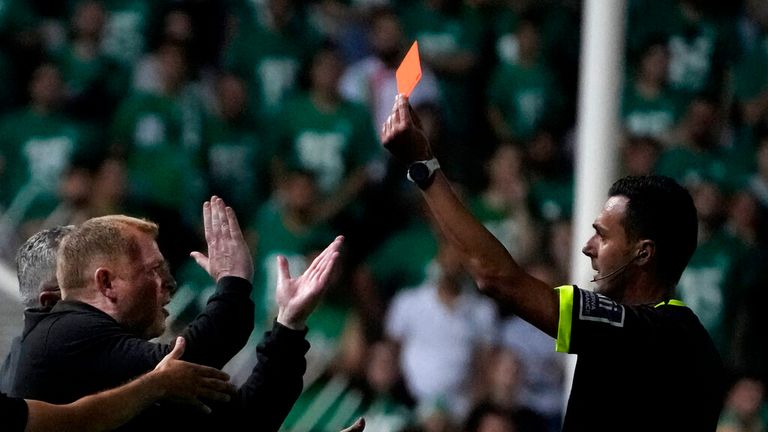 Omonia&#39;s coach Neil Francis Lennon, left, from Northern Ireland, receives a red card from the Italian referee Di Bello Marco during the final cup soccer match between Omonia FC and Ethnikos Achna FC at GSP stadium in Nicosia, Cyprus, Wednesday, May 25, 2022. (AP Photo/Petros Karadjias)