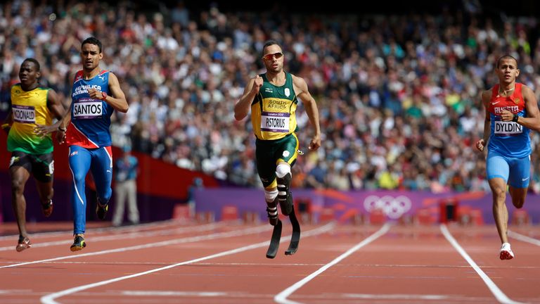 FILE - In this Saturday, Aug. 4, 2012 file photo, South Africa&#39;s Oscar Pistorius, center, leads Jamaica&#39;s Rusheen McDonald, left, Dominican Republic&#39;s Luguelin Santos, second left, and Russia&#39;s Maksim Dyldin, right, in a men&#39;s 400-meter heat during the athletics in the Olympic Stadium at the 2012 Summer Olympics, in London. (AP Photo/Anja Niedringhaus, File)


