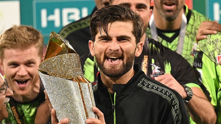 Lahore Qalanders captain Shaheen Shah Afridi holds up the PSL trophy after his match-winning efforts in the final