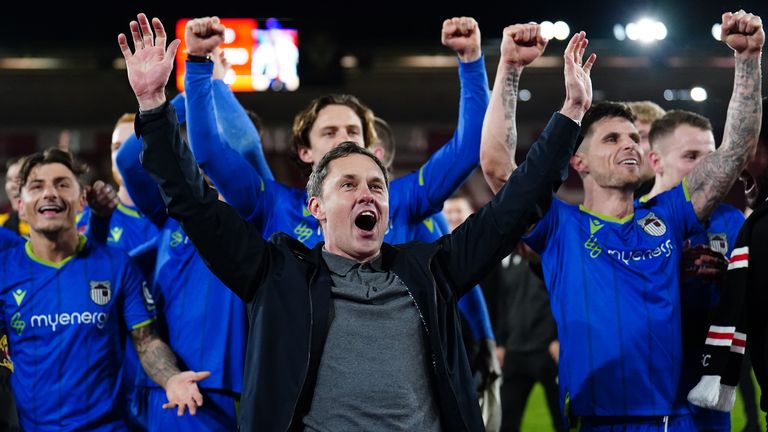 Grimsby Town players and manager Paul Hurst celebrate their FA Cup win over Southampton