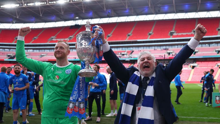 Warrington Rylands owner Paul Stretford (right) lifts the FA Vase at Wembley 