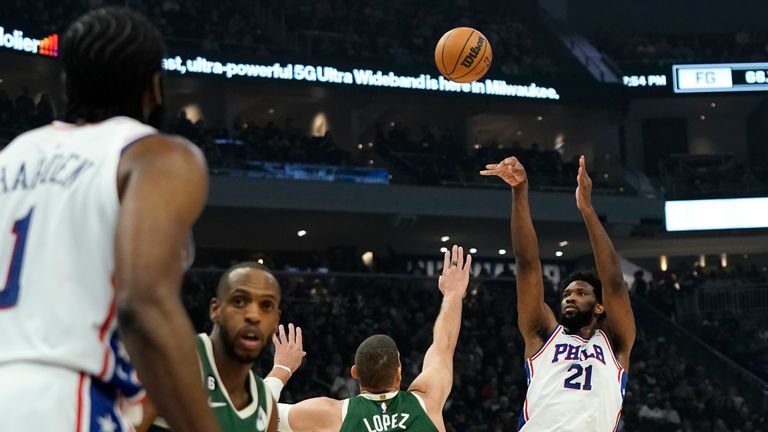 Philadelphia 76ers&#39; Joel Embiid (21) shoots against Milwaukee Bucks&#39; Brook Lopez (11) during the first half of an NBA basketball game Saturday, March 4, 2023, in Milwaukee. 