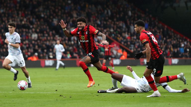 Bournemouth's Philip Billing goes down under a challenge by Liverpool's Ibrahima Konate