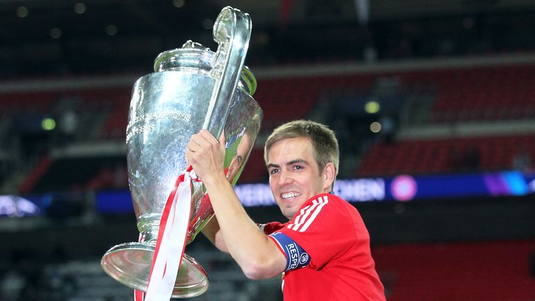 Philipp Lahm celebrates with the trophy after Bayern Munich's 2013 Champions League final win over Borussia Dortmund