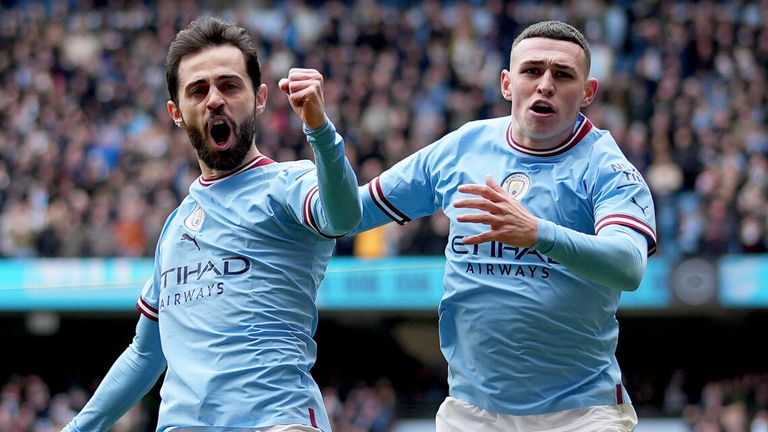 Bernardo Silva celebrates with Phil Foden after giving Manchester City a 2-0 lead over Newcastle