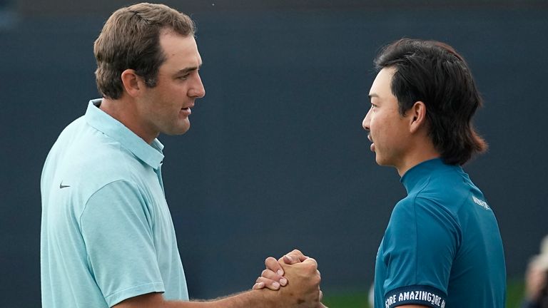 Scottie Scheffler, left, shakes hands with Min Woo Lee after the final round of The Players Championship golf tournament, which Scheffler won, Sunday, March 12, 2023, in Ponte Vedra Beach, Fla. (AP Photo/Eric Gay)