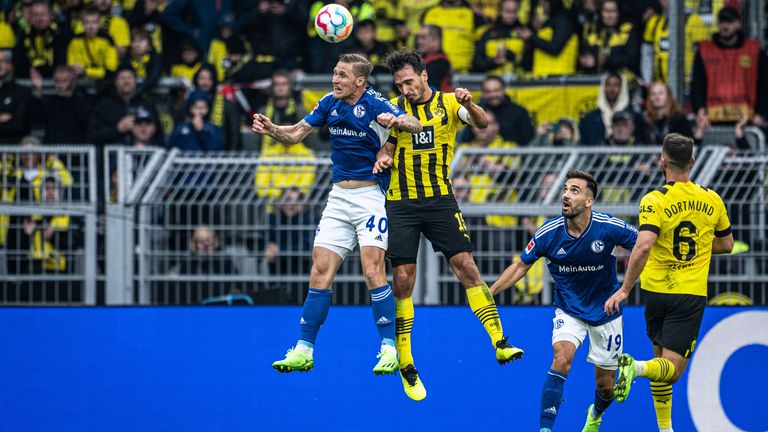 Schalke forward Sebastian Polter battles for the ball with Borussia Dortmund defender Mats Hummels [Credit: DFL]