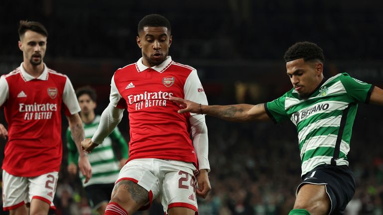 Sporting's Marcus Edwards, right, duels for the ball with Arsenal's Reiss Nelson, center, during the Europa League round of 16, second leg, soccer match between Arsenal and Sporting CP at the Emirates stadium in London, Thursday, March 16, 2023. (AP Photo/Ian Walton)